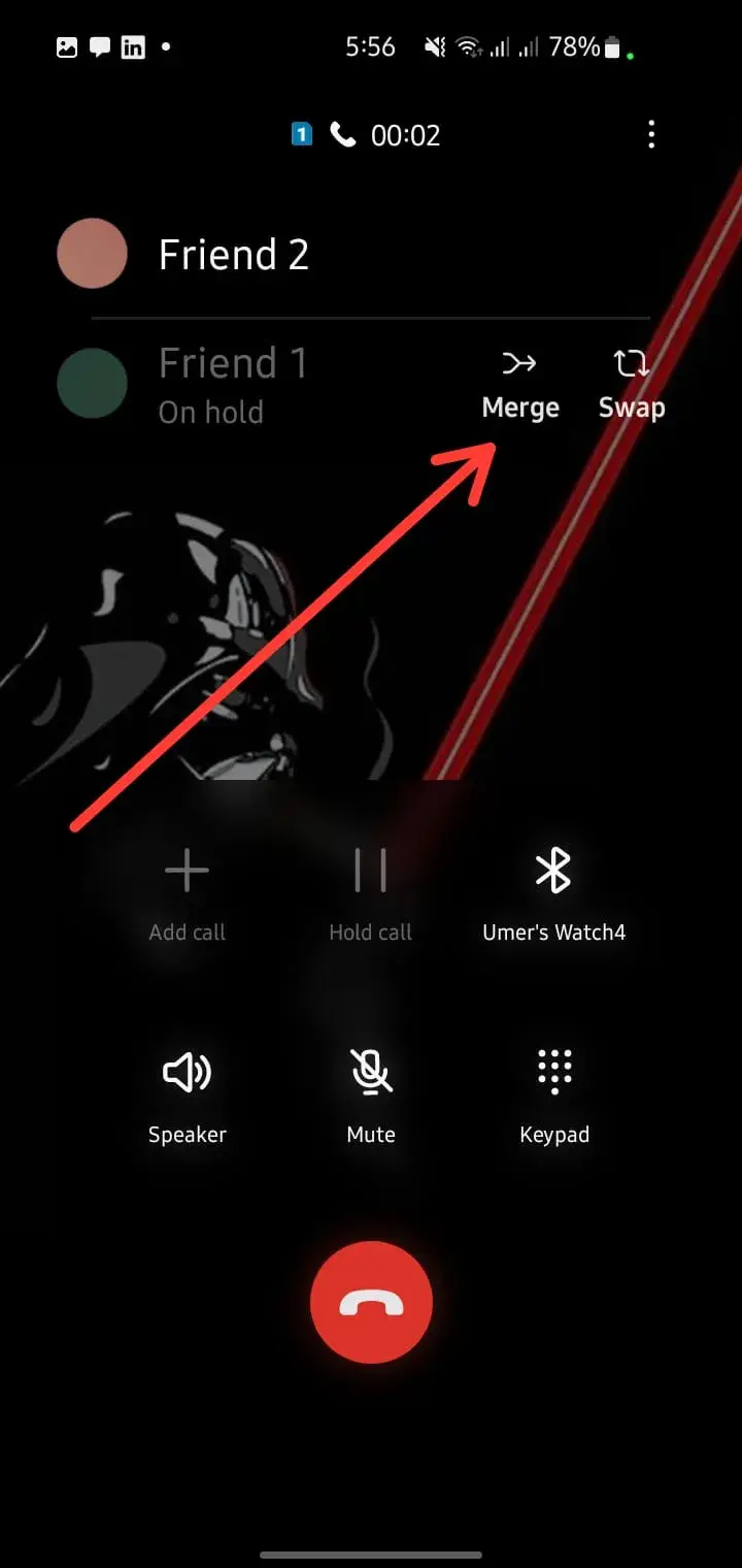 Merging two calls to start a Ufone conference call on a mobile phone