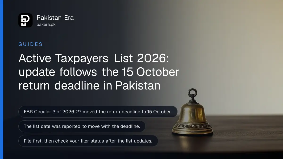 Still life of a small brass bell on a dark wooden table, for a guide to the Active Taxpayers List update in Pakistan