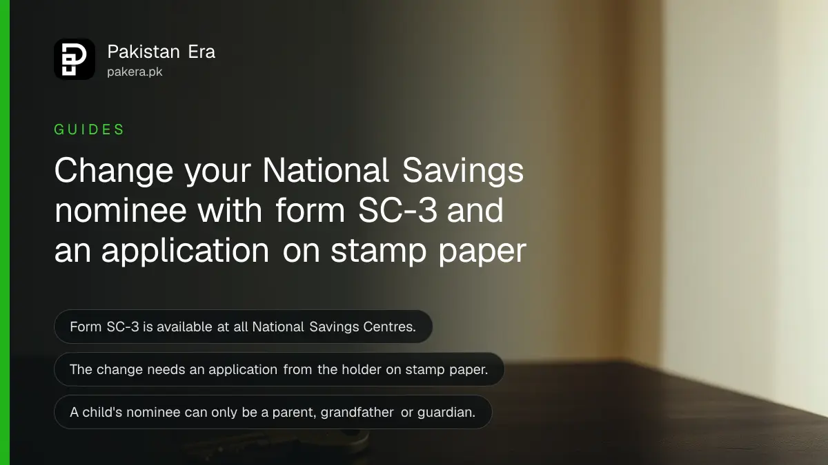 A brass key on a dark wooden table, for a guide to changing a National Savings nominee in Pakistan