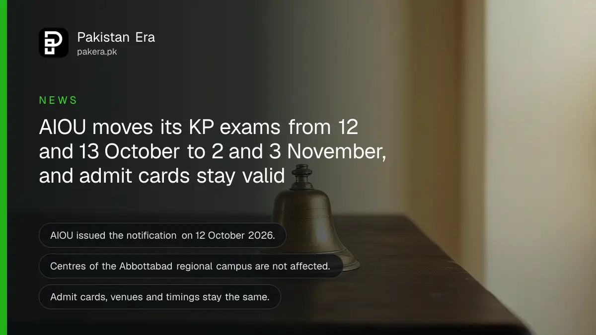 A brass bell on a dark wooden table, for an article on AIOU exams postponed in Khyber Pakhtunkhwa