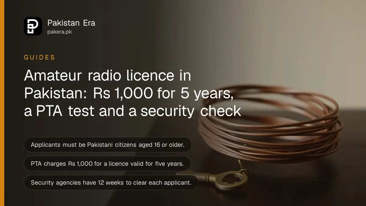 An old brass key and a coil of copper wire on a dark wooden table, for a guide to amateur radio licences in Pakistan