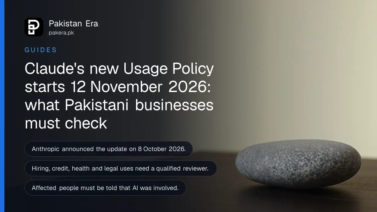 Still life of a smooth round grey stone on a dark wooden table, for a guide to the Claude Usage Policy in Pakistan