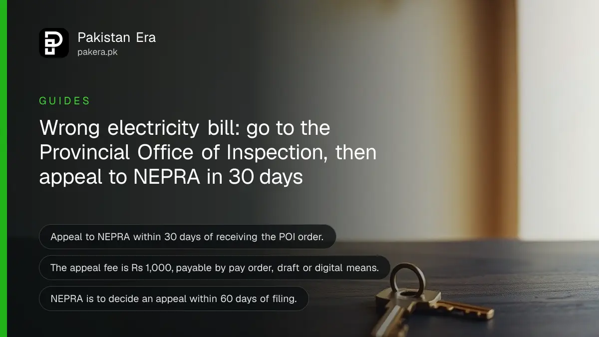 A brass key on a dark wooden table, for a guide to the provincial office of inspection electricity bill appeal
