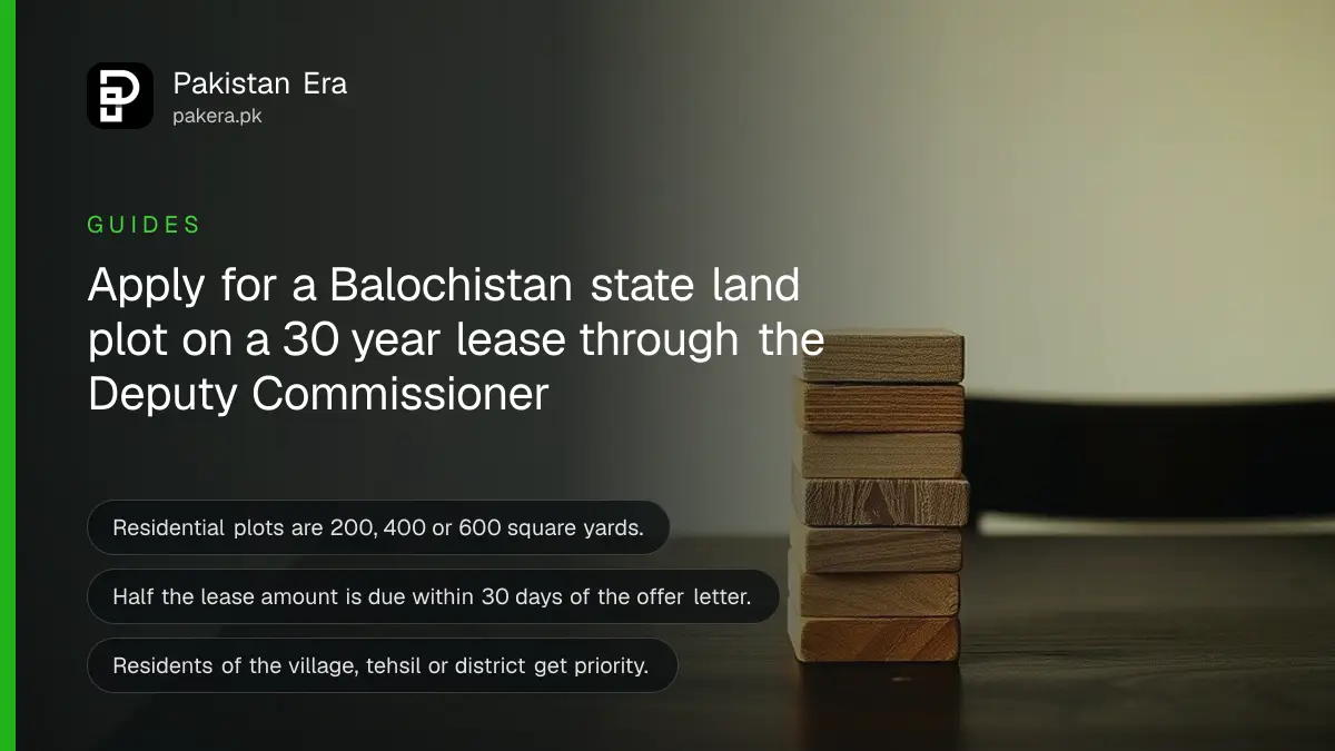 Stacked wooden blocks on a dark wooden table against a plain cream wall, for a guide to leasing state land in Balochistan