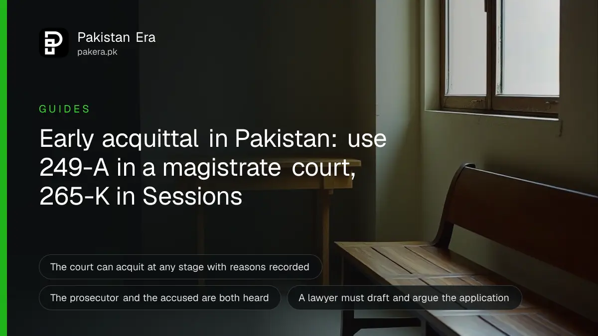 An empty courtroom with wooden benches and a raised judge's desk in soft daylight