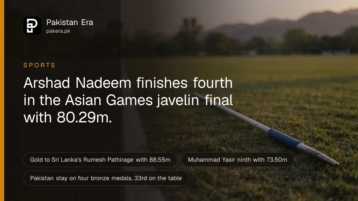 A javelin lying on green grass beside a white painted line at dusk