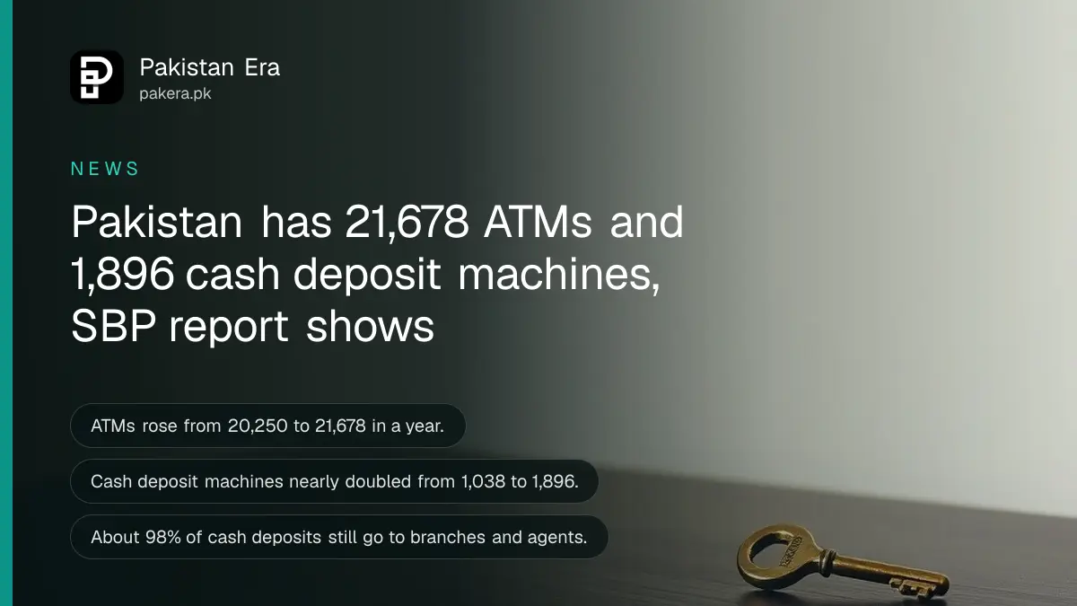 A brass key on a dark wooden table, for an article on ATM and cash deposit machine counts in Pakistan