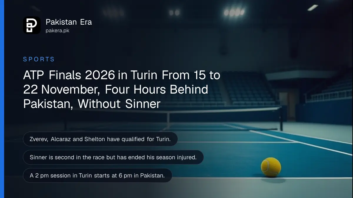 An empty indoor tennis arena with a blue hard court and a yellow ball near the baseline