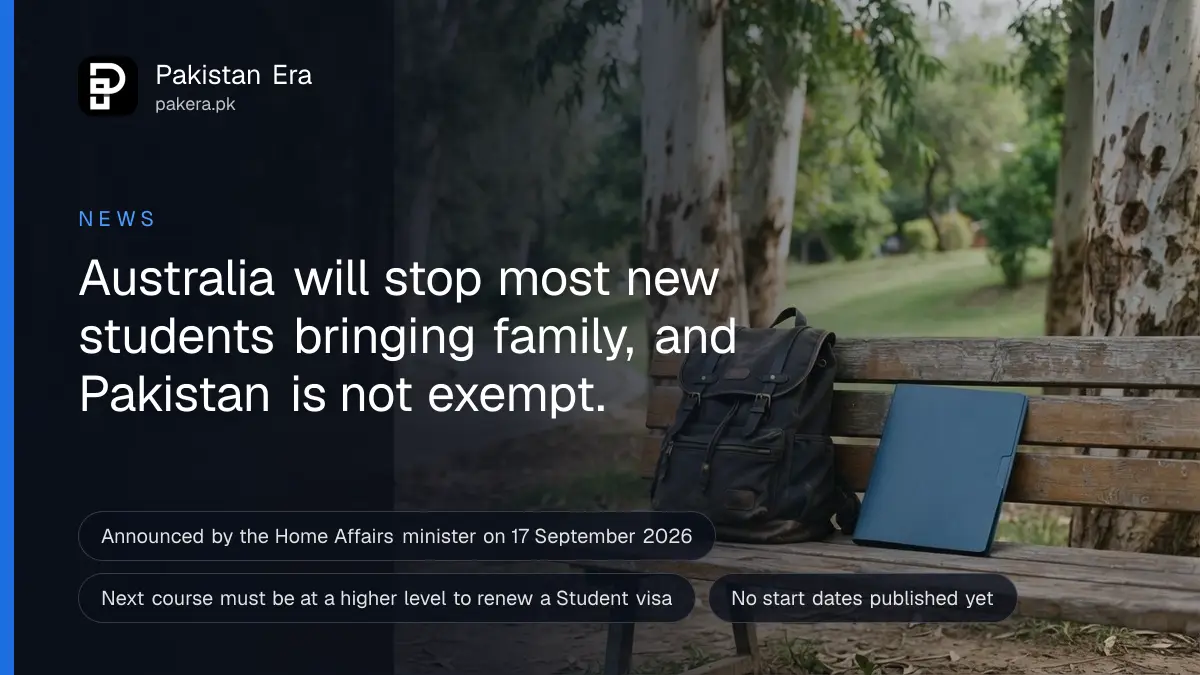 A student's backpack and a closed folder resting on a wooden campus bench under tall eucalyptus trees