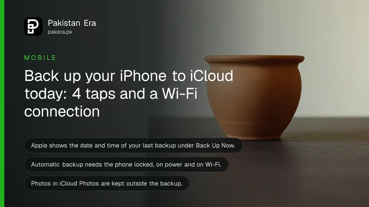 Still life of a plain terracotta pot on a dark wooden table, for an iPhone backup guide