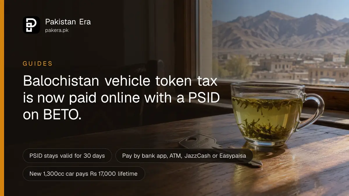 A car key and a cup of tea on a wooden table beside a sunny window in Quetta