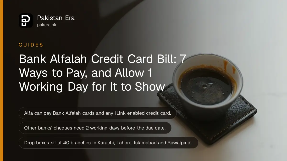 A plain dark leather card holder beside a cup of coffee on a marble cafe table