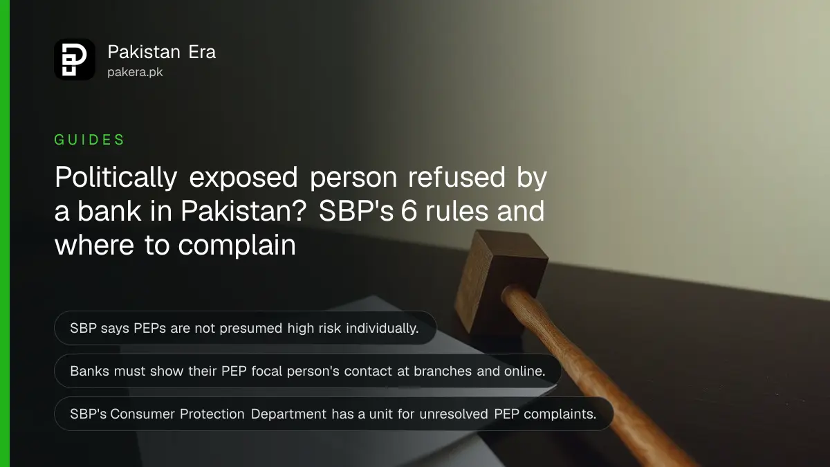 A wooden gavel beside blank paper on a dark table, for a guide on bank rules for politically exposed persons in Pakistan