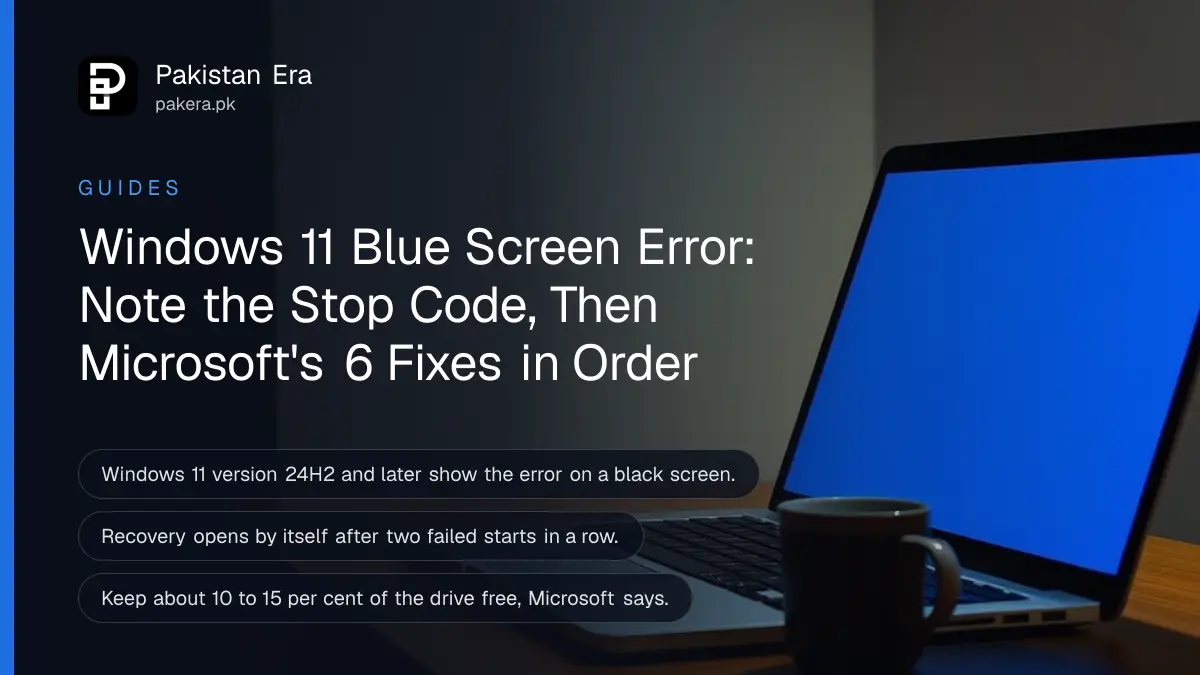 An open plain silver laptop seen from the side on a desk at night, its screen glowing deep blue