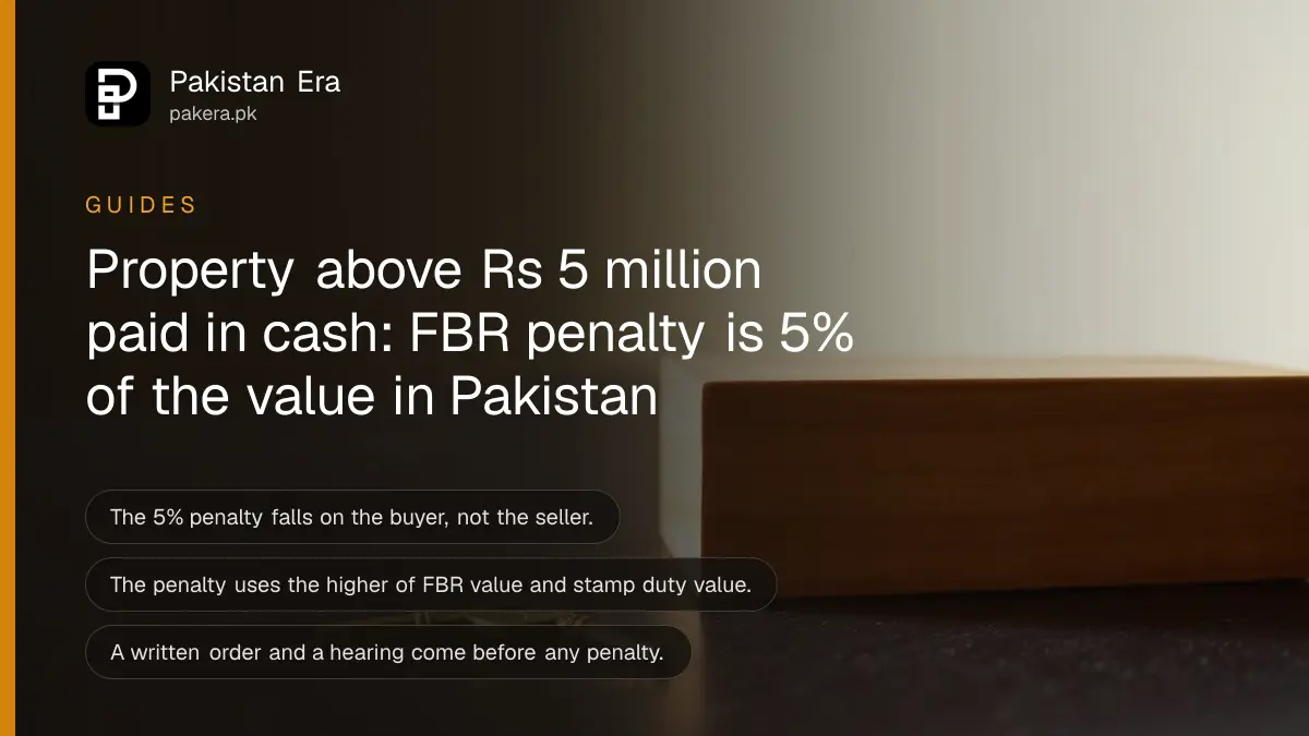 A small brass key beside a wooden block on a dark table, for a guide on cash property purchases and the FBR penalty in Pakistan