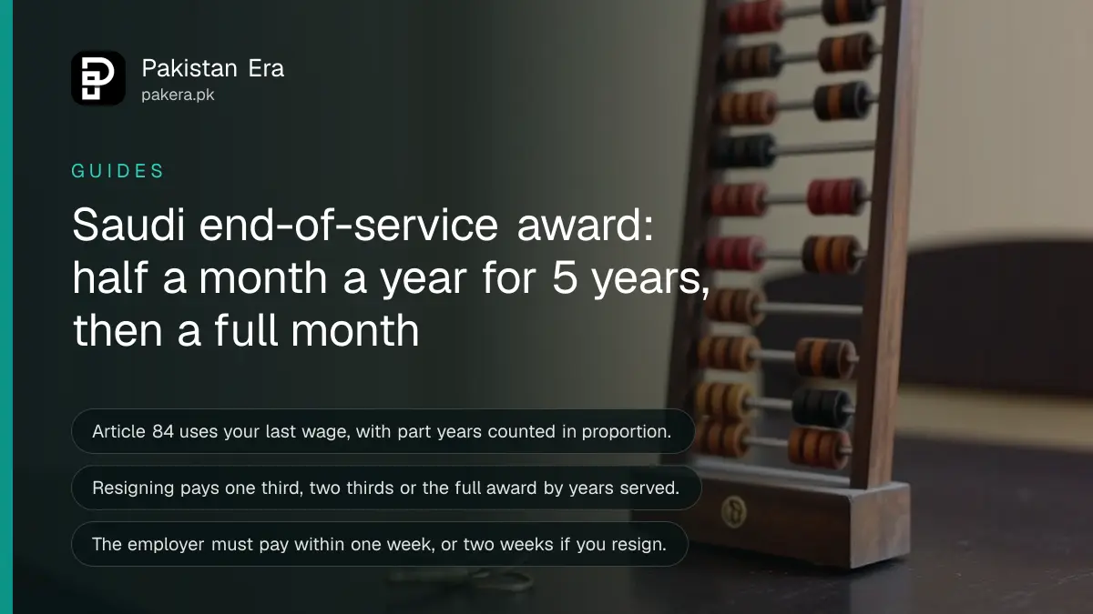 An abacus and a brass key on a dark wooden table, for a guide to the Saudi end-of-service award