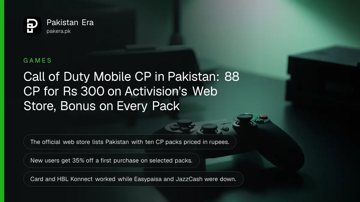 A black wireless game controller and a smartphone in a small stand on a desk lit by a soft green lamp