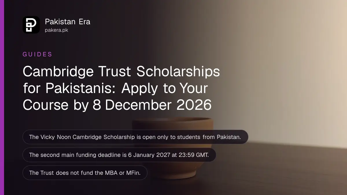 A plain clay cup on a dark wooden table against a plain cream wall in soft daylight
