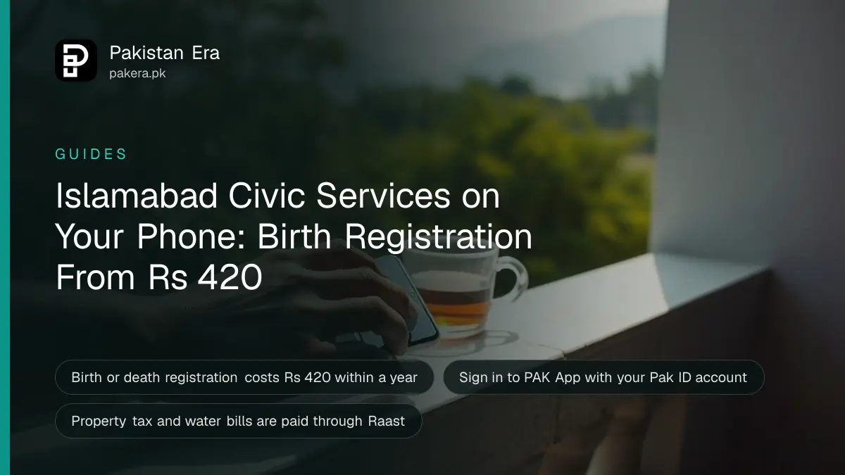A hand holding a smartphone face down beside a cup of tea on a balcony railing, with green trees and the Margalla Hills behind in Islamabad