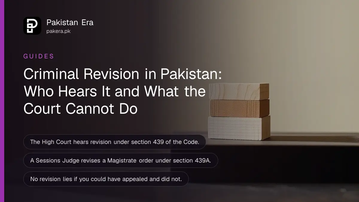 Plain wooden blocks on a dark wooden table, for a criminal revision petition in Pakistan