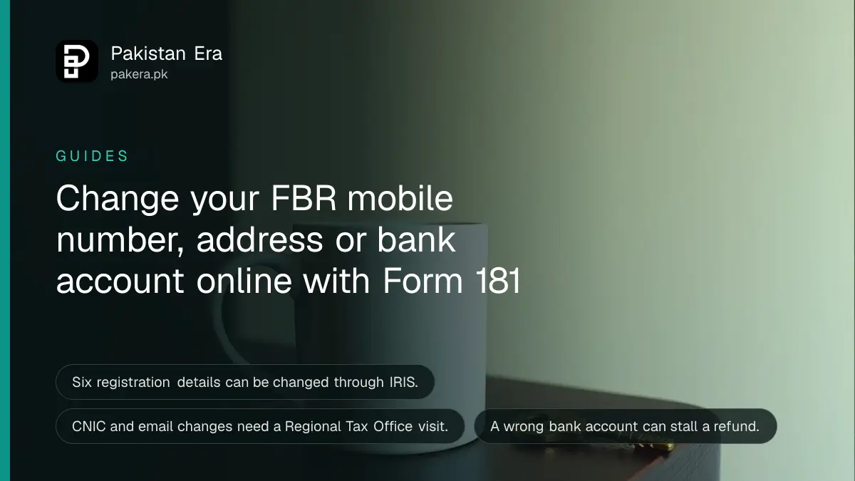 A mug and a brass key on a dark wooden table, for a guide on how to change mobile number in FBR IRIS