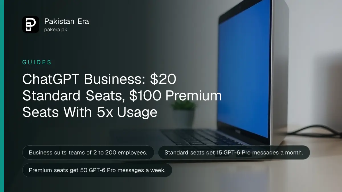 An open laptop with a glowing screen on a tidy desk beside a plant