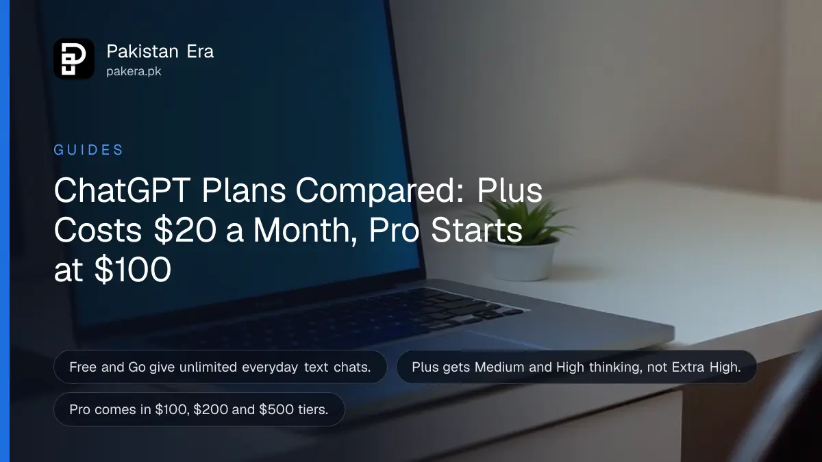 An open laptop with a glowing screen on a white desk beside a plant