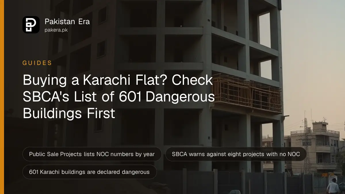 An unfinished concrete apartment block with bare columns and scaffolding against a clear evening sky in Karachi