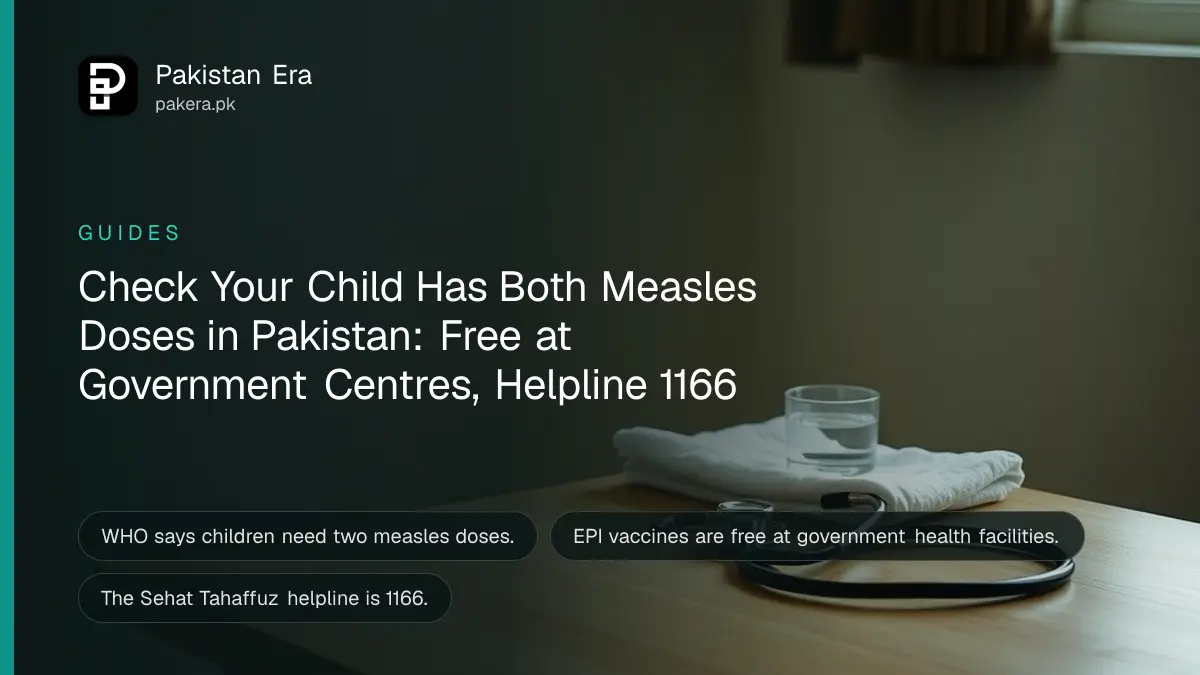 A small paper vaccination card and a pen on a wooden table in a Pakistani home with soft window light
