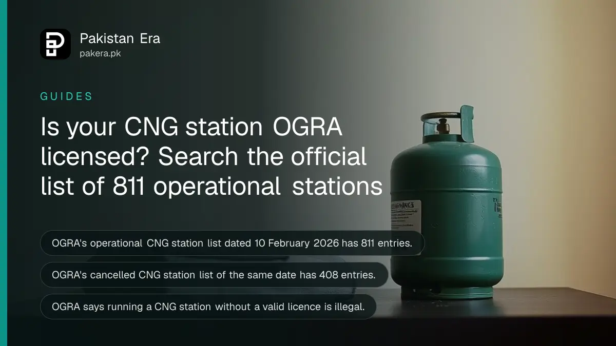 A green gas cylinder and a folded towel on a dark wooden table, for a guide to checking CNG station licences