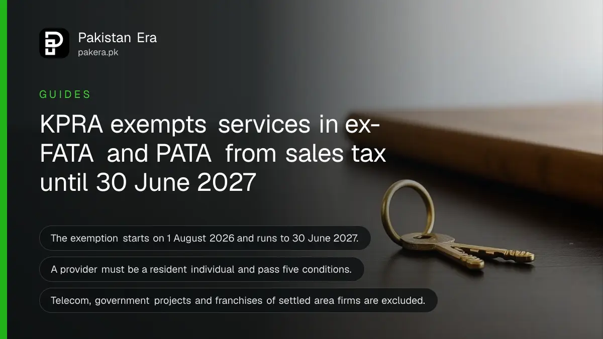A plain brass key on a dark wooden table, for an article on the KPRA sales tax exemption in ex-FATA and PATA