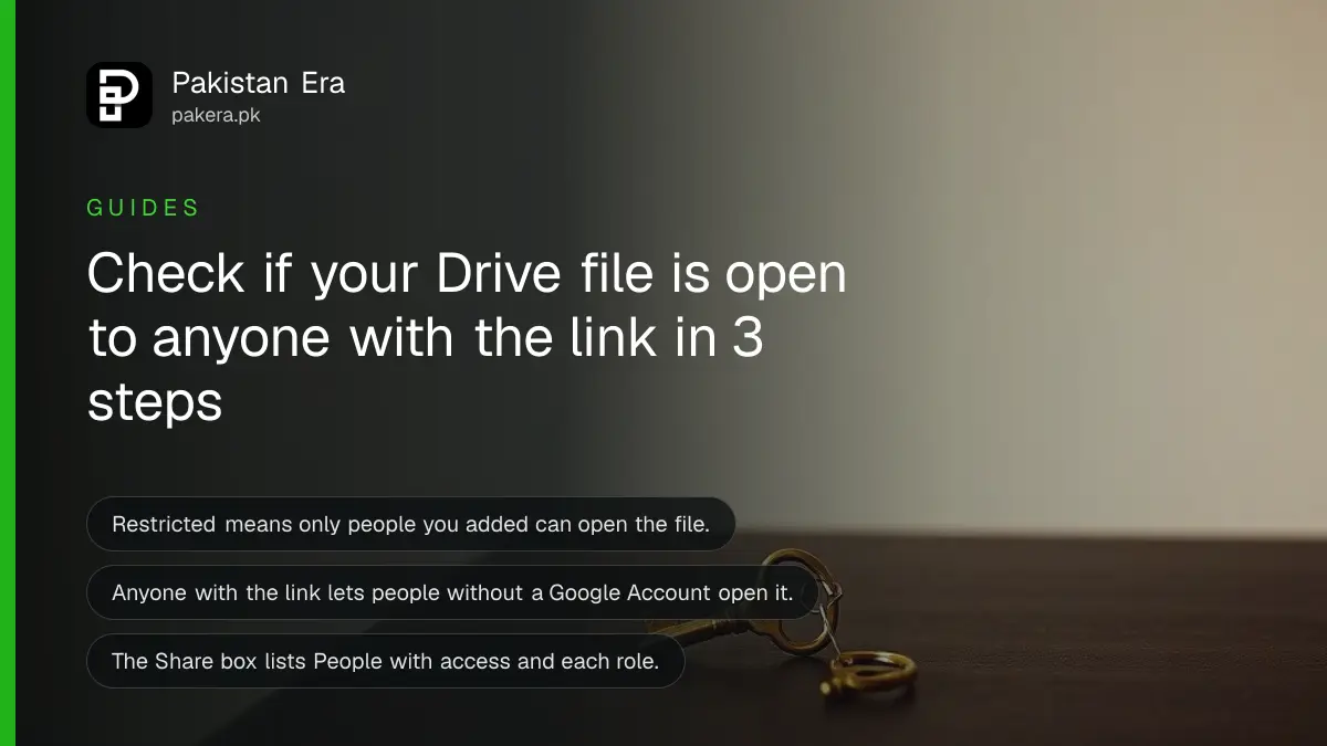 A small brass key on a dark wooden table, for a guide to checking Google Drive sharing in Pakistan