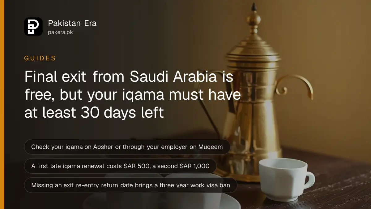 Close-up of a brass dallah coffee pot, small cups and a bowl of dates on a dark wooden table against a plain cream wall