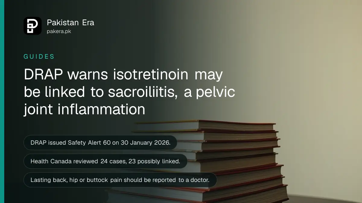A stack of plain books on a dark wooden table, for a DRAP safety alert on isotretinoin