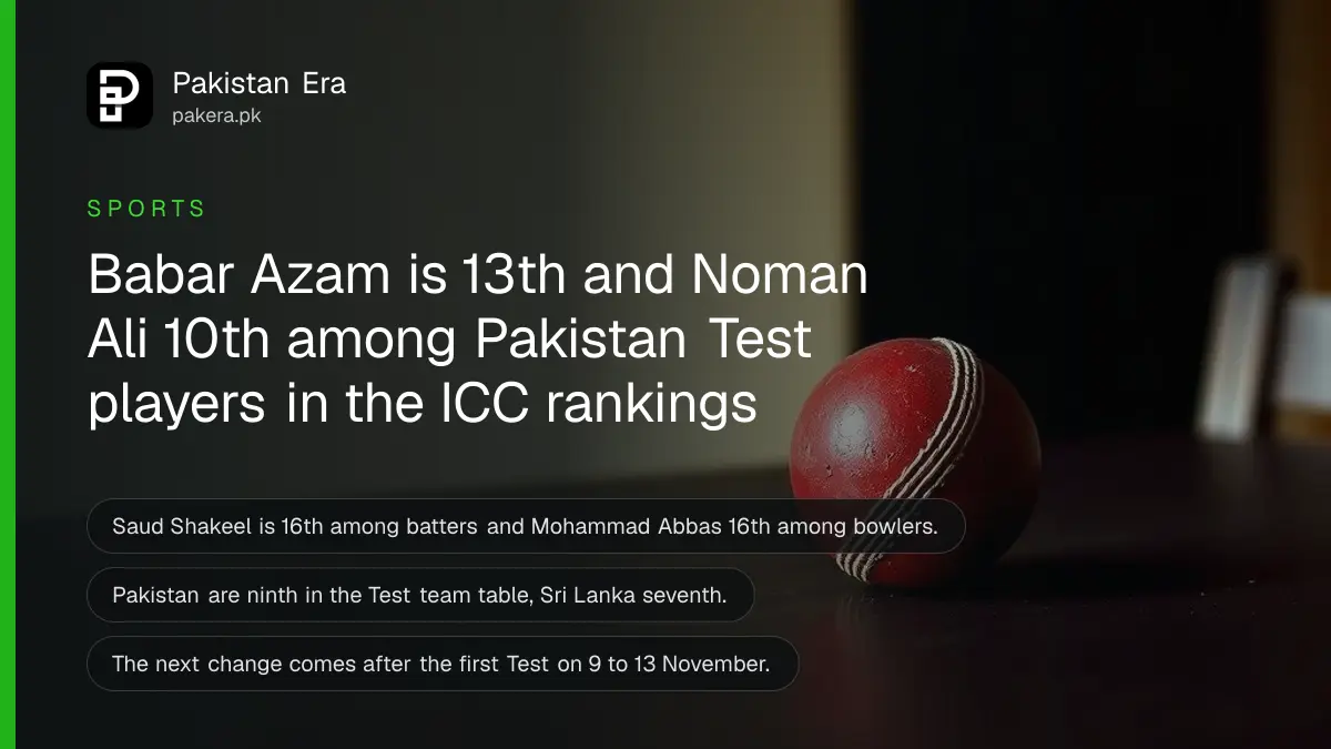 A red cricket ball on a dark wooden table, for an article on Pakistan players in the ICC Test rankings