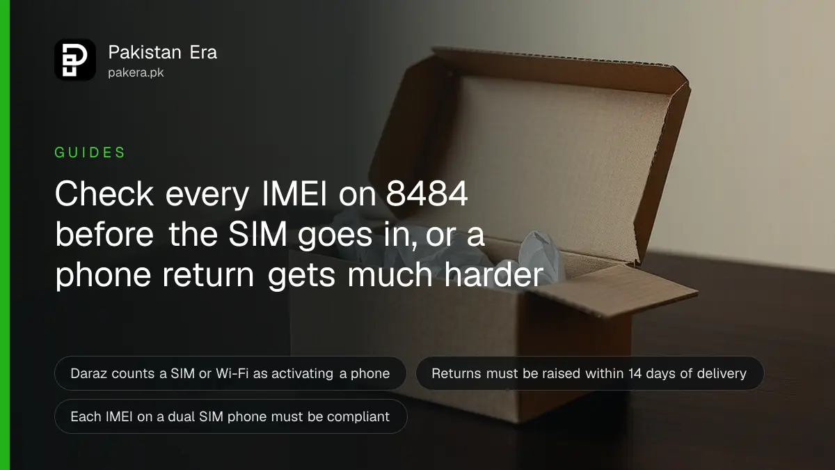 An opened plain cardboard phone box with a small SIM ejector pin beside it on a dark wooden table