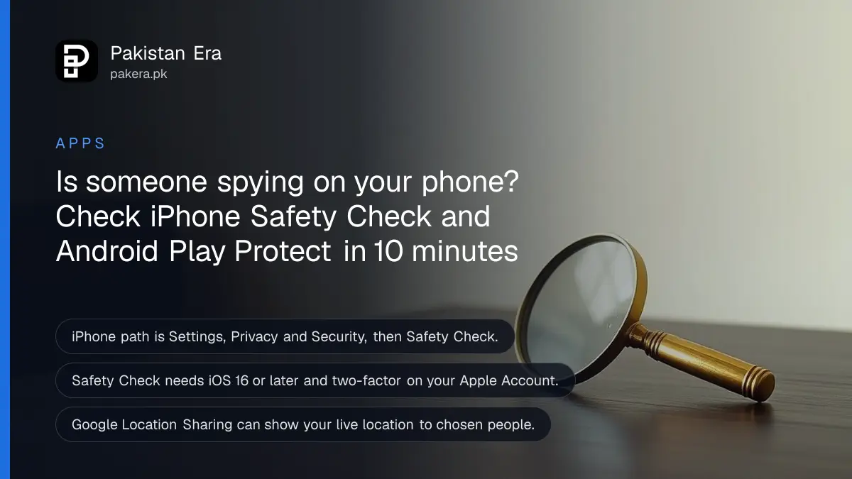 A brass magnifying glass on a dark wooden table against a plain cream wall, for an article on checking a phone for spyware