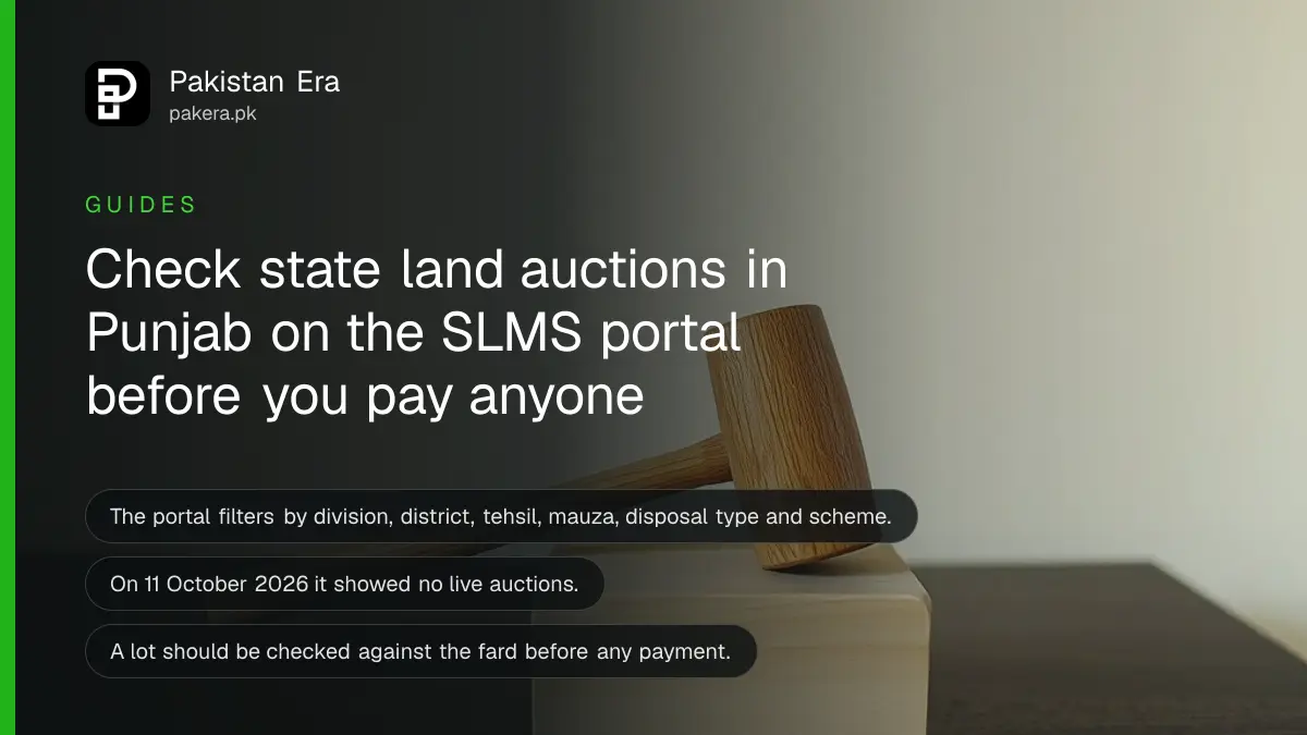 A wooden gavel on a block on a dark wooden table, for a guide to Punjab state land auctions