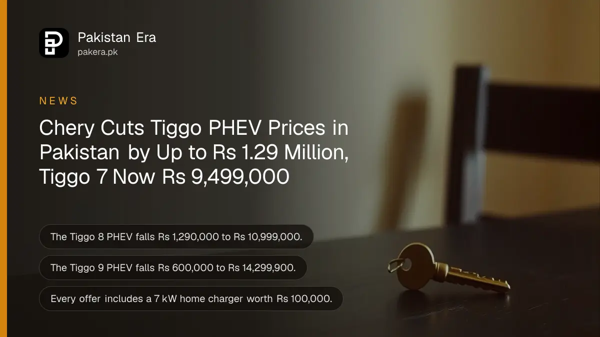 A single brass car key on a dark wooden table against a plain cream wall in soft daylight