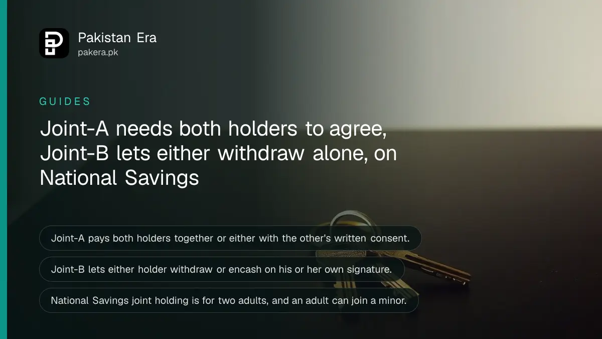 Two brass keys on a ring on a dark wooden table, for a guide on joint National Savings holders in Pakistan