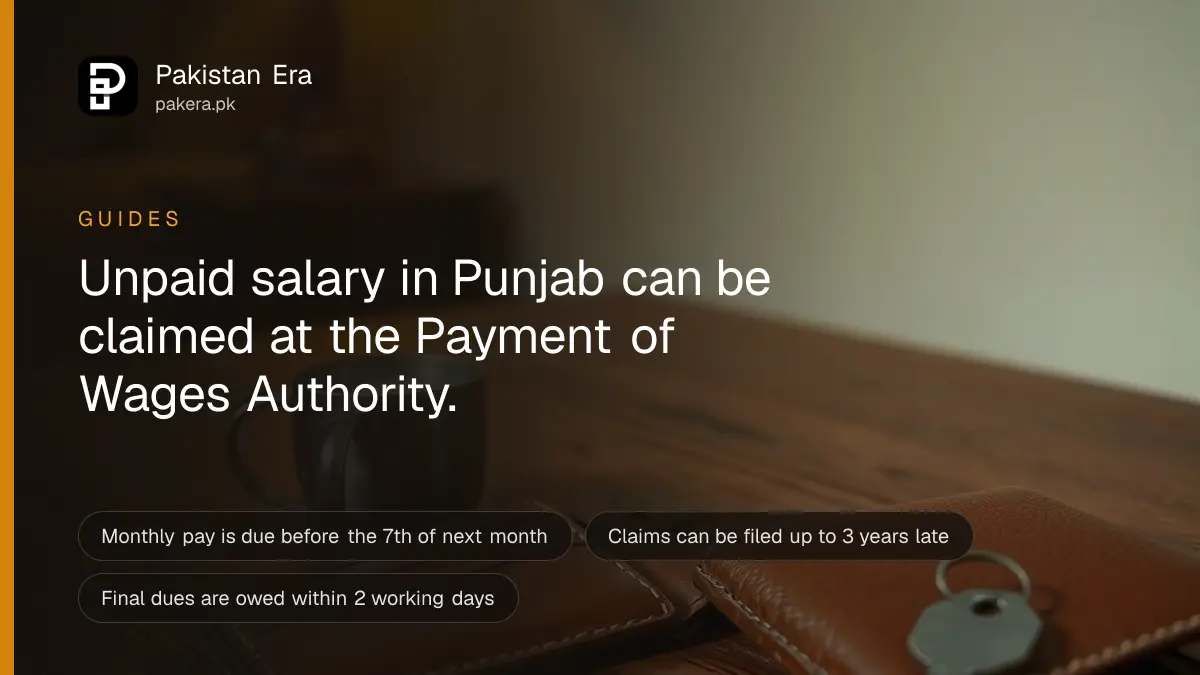 An empty leather wallet lying open on a wooden table beside a steel cup of tea and a set of keys