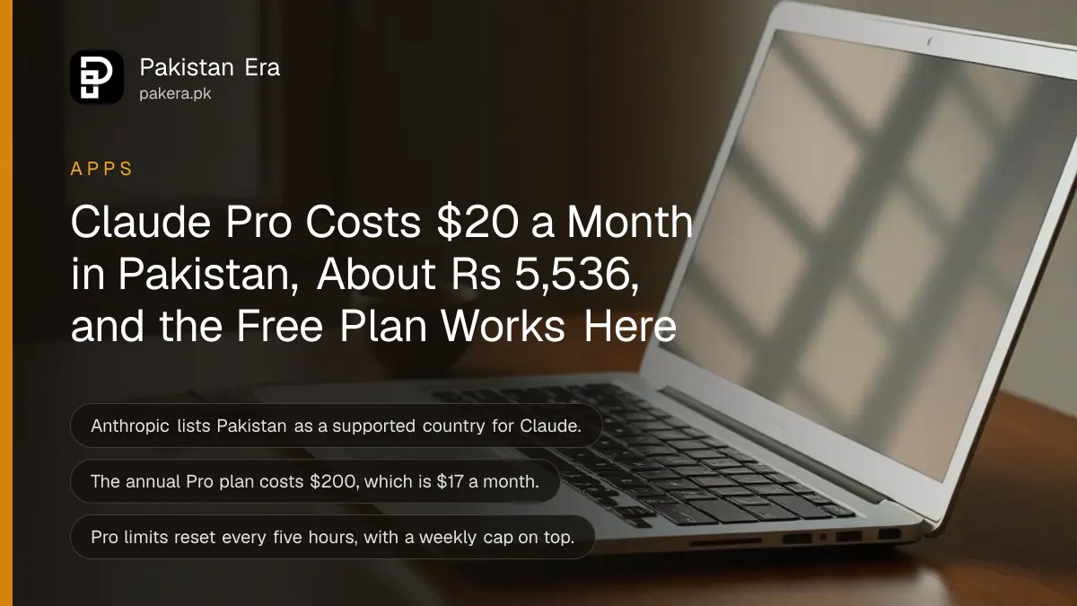 An open plain silver laptop on a tidy desk with its screen glowing, a cup of chai and a brown leather wallet beside it
