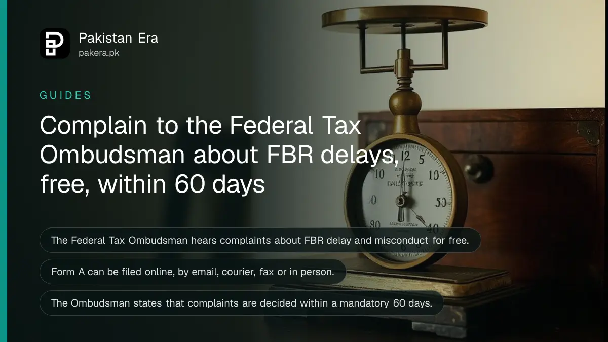 A brass balance scale beside a closed wooden box on a dark wooden table, for a guide on complaining to the Federal Tax Ombudsman