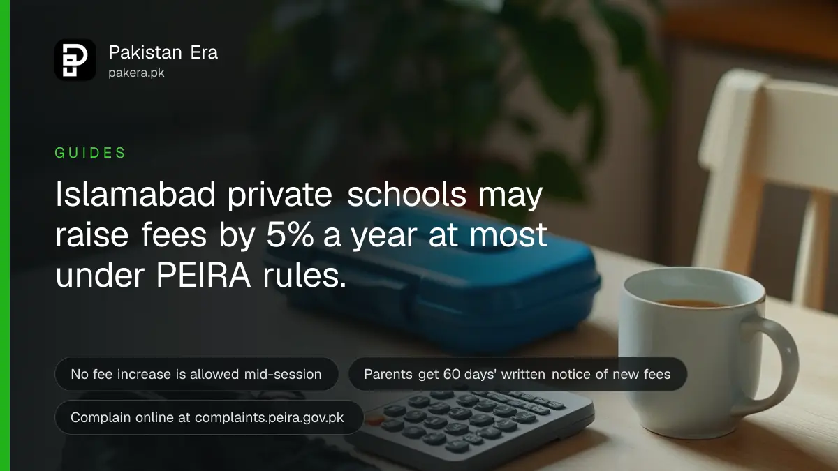 A small child's school shoes and a lunch box beside a calculator on a kitchen table