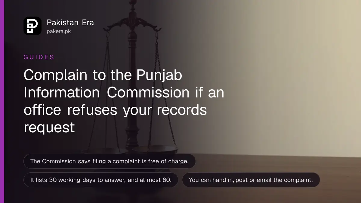 A brass scale on a dark wooden table, for a guide on complaining to the Punjab Information Commission