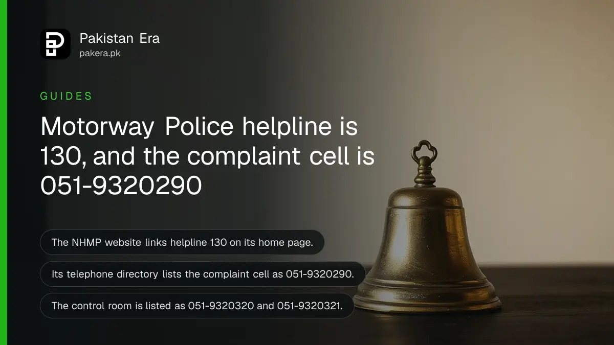 A brass bell on a dark wooden table, for a guide to contacting the Motorway Police in Pakistan