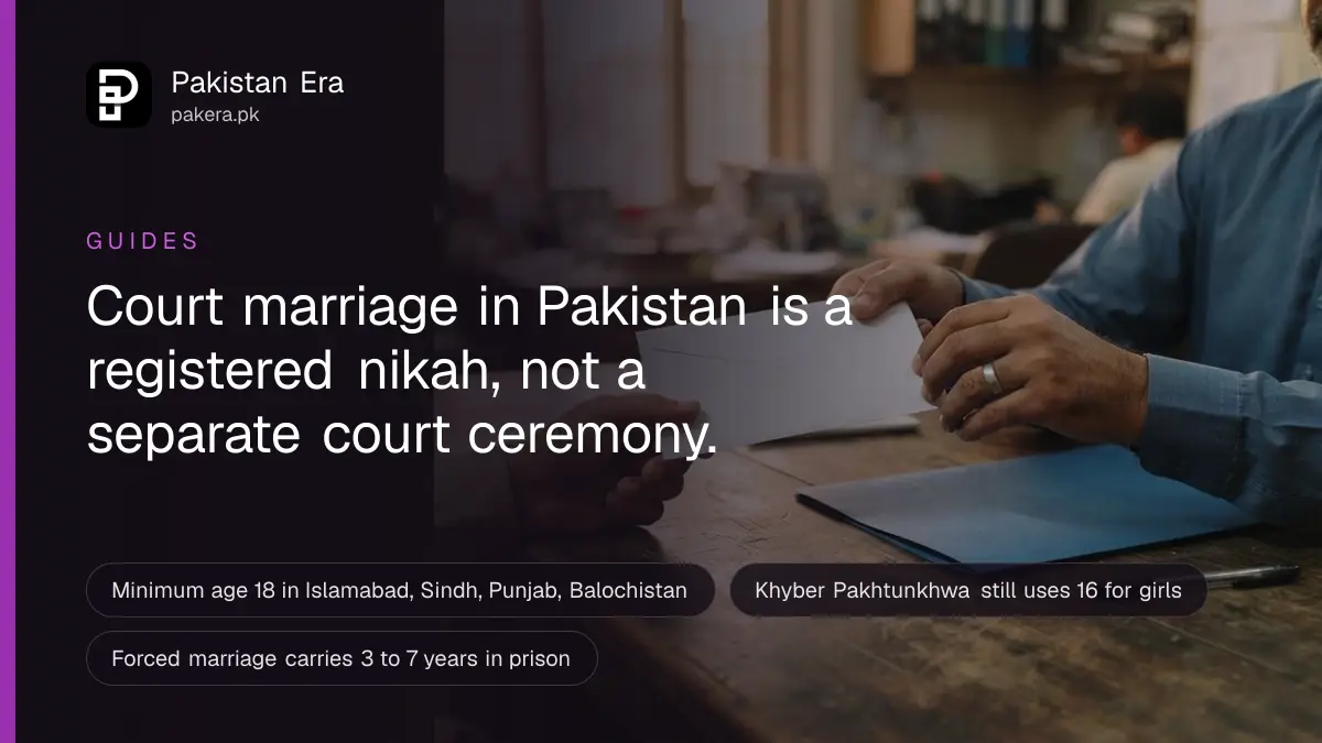 Two hands passing a plain white envelope across a wooden table in a Lahore office