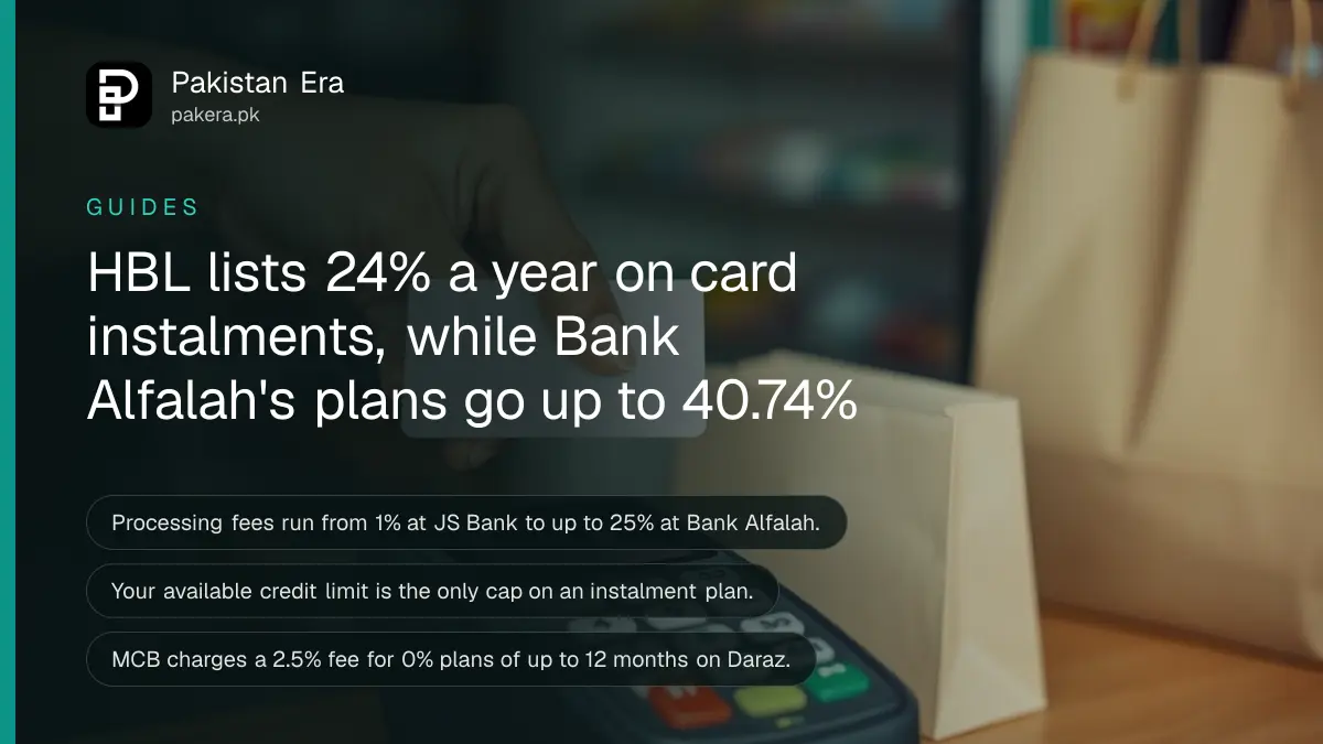 A hand holding a plain bank card over a card machine on a shop counter, with a shopping bag beside it