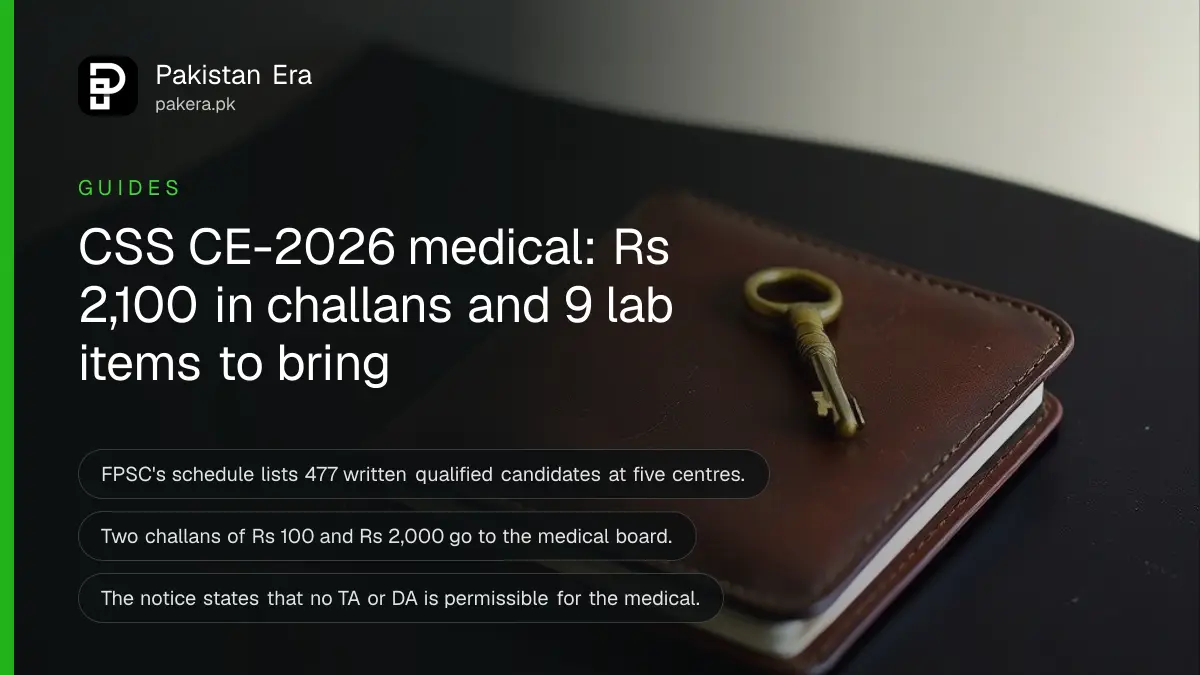 A closed leather notebook and a brass key on a dark wooden table, for a guide to the CSS CE-2026 medical examination