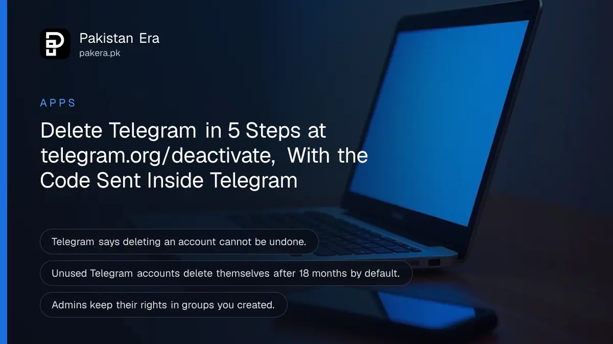 An open plain silver laptop seen from the side on a tidy desk at night, screen softly glowing blue, with a smartphone face down beside it